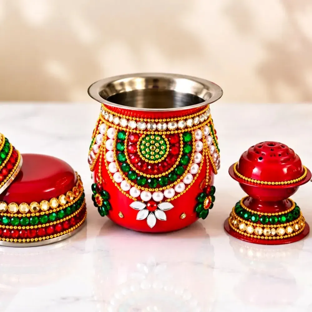 Decorative red kalash and puja accessory detail